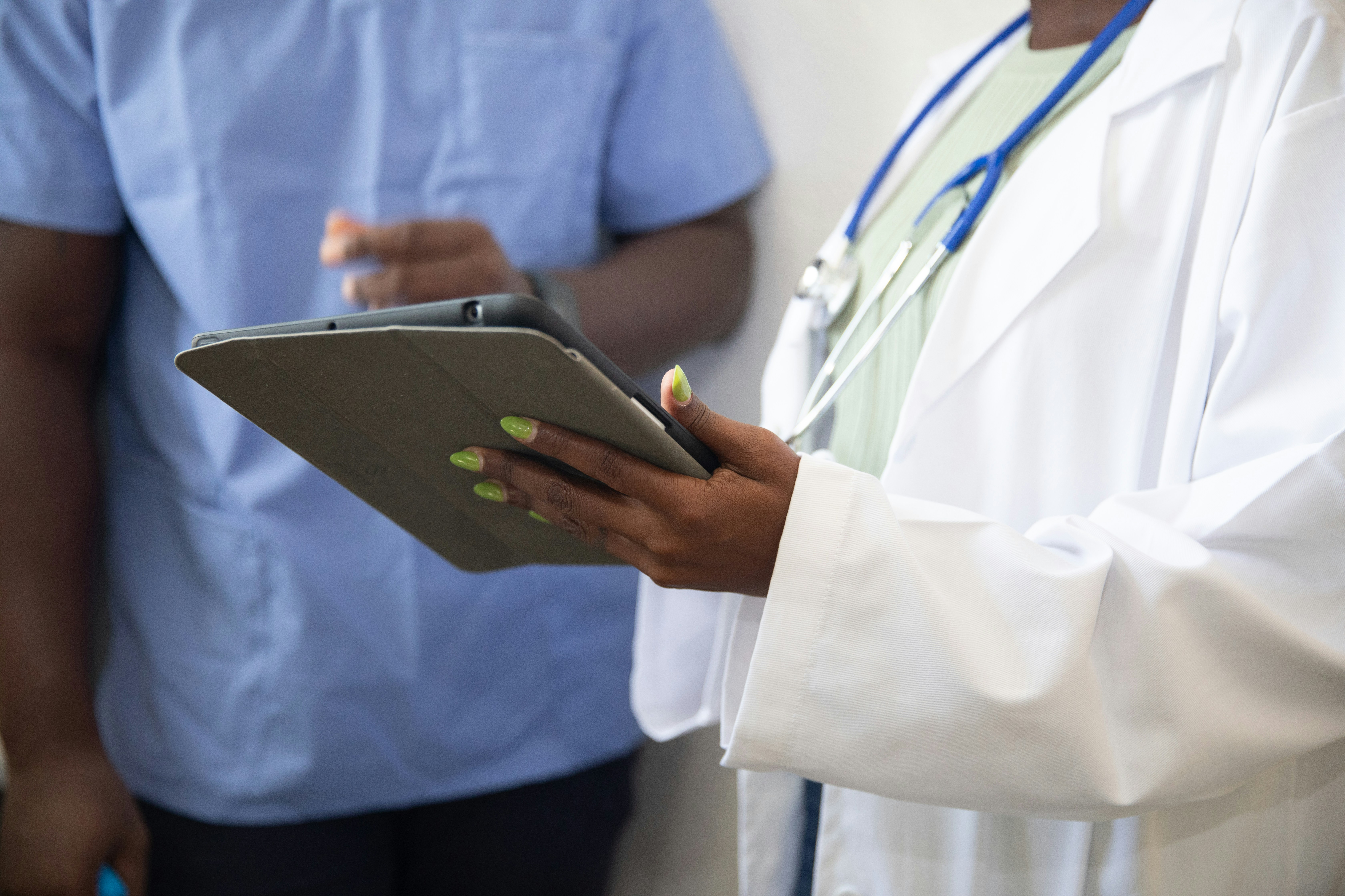 A doctor shows a patient medical data